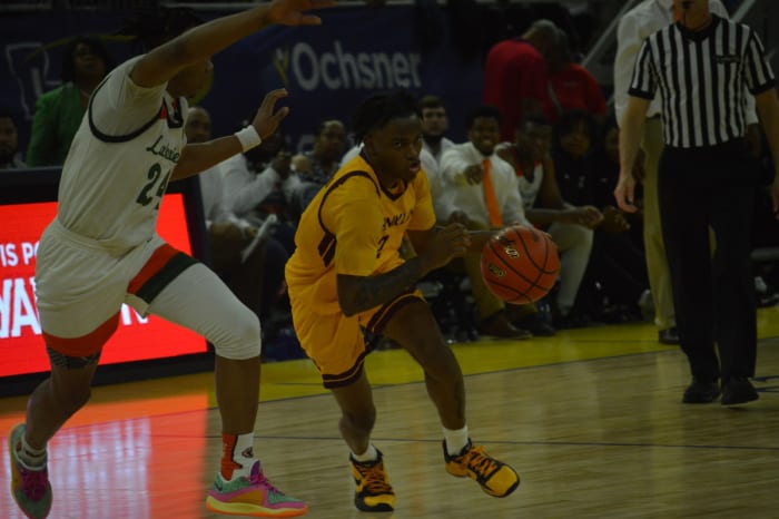 Franklin senior Jay'Shaun Johnson drives down the lane against Lakeview during the Division IV non-select championship game at Burton Coliseum on March 8, 2024.